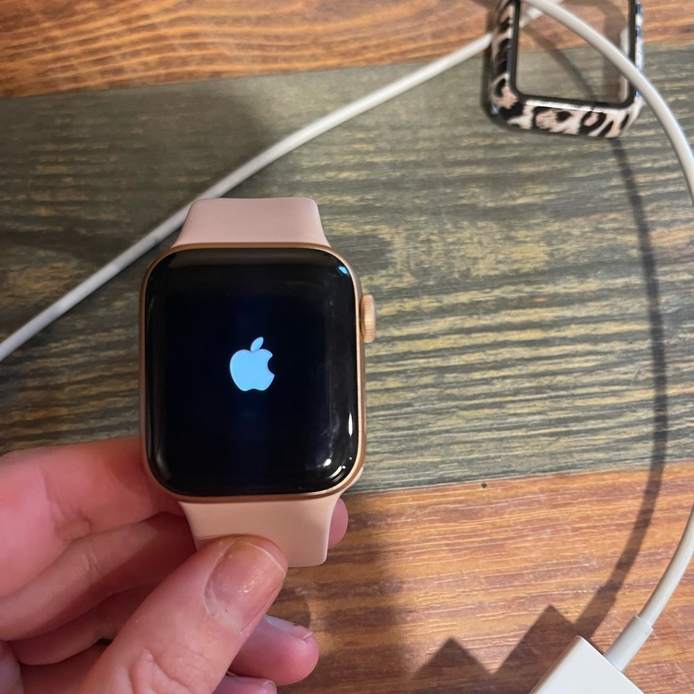Gently used Apple Watch Series 6 . With light pink small band, charging cable.